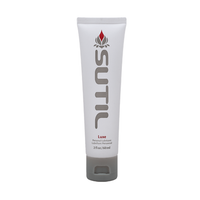 Sutil Luxe water-based personal lubricant in a white tube with a grey cap.