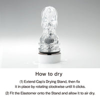 A clear textured masturbator with a white drying stand.