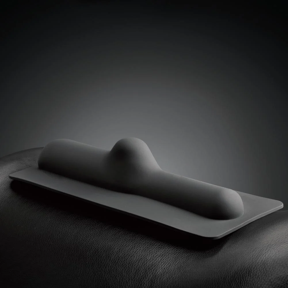 Black silicone non-penetrative attachment with a rounded shape.