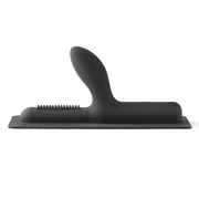 Black ribbed silicone attachment with a curved top and textured surface.