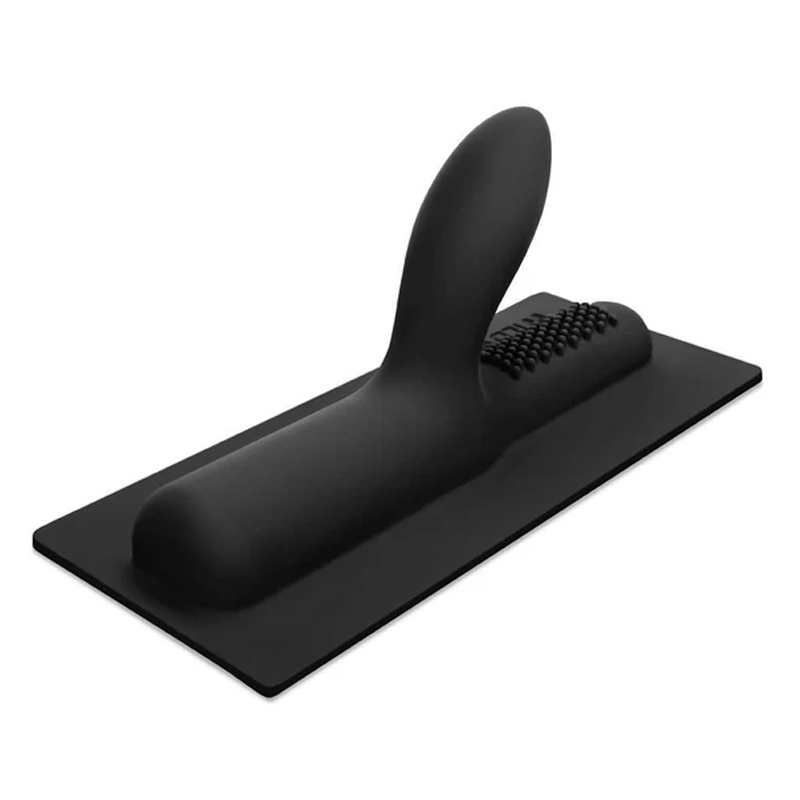Black ribbed silicone attachment with a textured surface on a rectangular base.