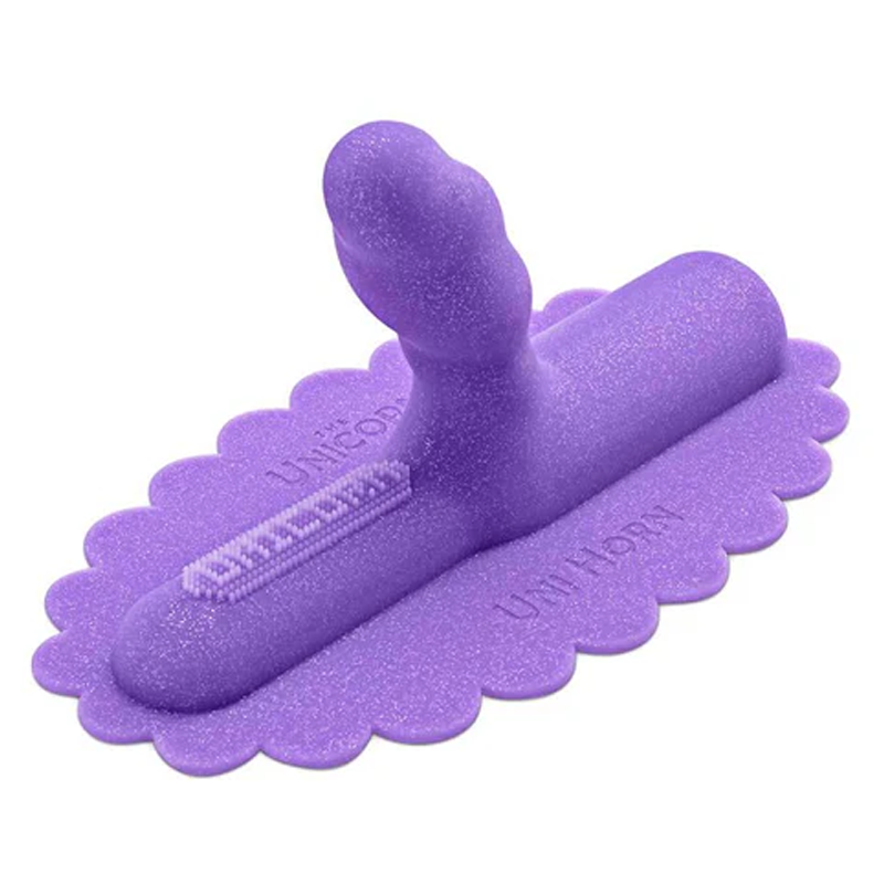 A purple silicone Uni Horn attachment with a textured tip and scalloped base.