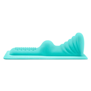 A teal clitoral and perianal attachment with a textured surface and cascading waves.