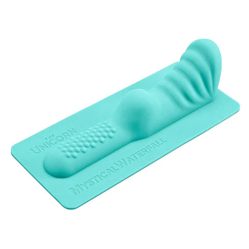 A teal clitoral and perianal attachment with textured surfaces.