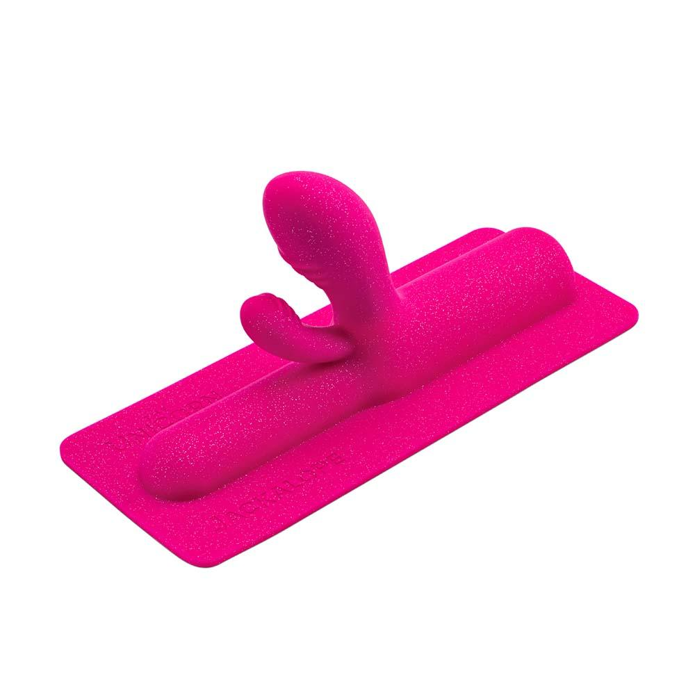 A pink glittery Jackalope dual bulbous attachment with two curved ends.