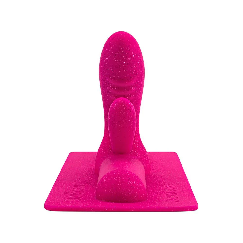 A pink glittery dual bulbous attachment for a sex toy.