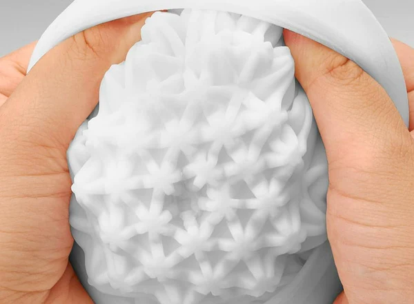 Tenga Geo Coral reusable male masturbator with intricate geometric textures.
