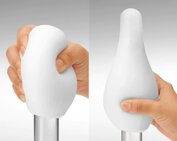 Tenga Geo Coral reusable male masturbator with a stretchy white sleeve.