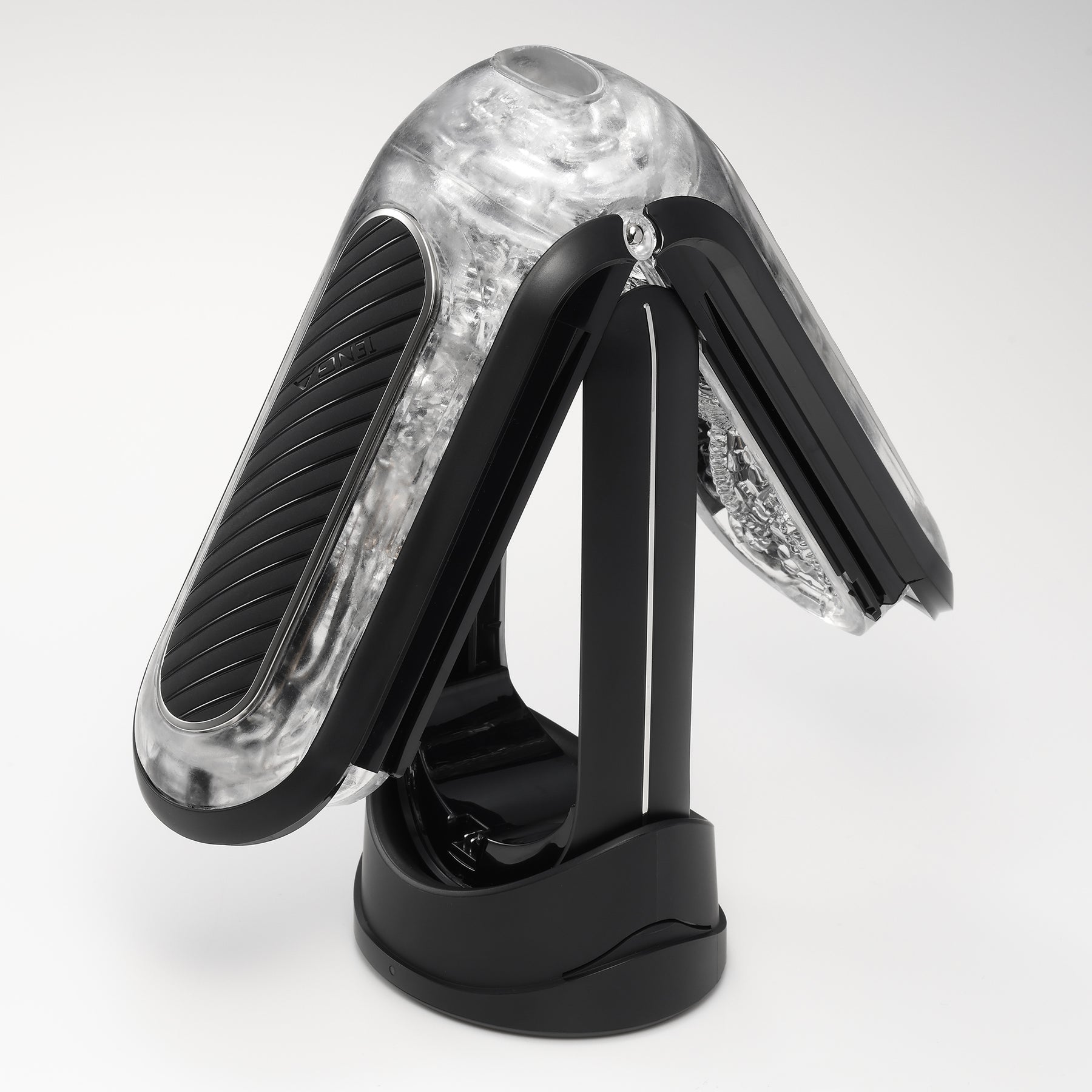 Tenga Flip Zero Gravity EV rechargeable vibrating stroker with clear textured interior and black base.