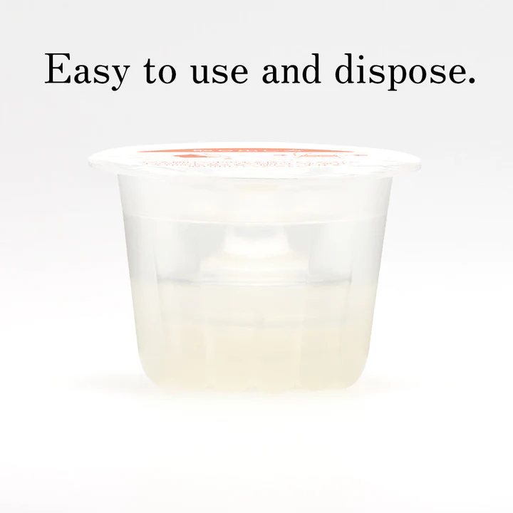 A clear disposable cup with a white lid containing a light-colored gel.
