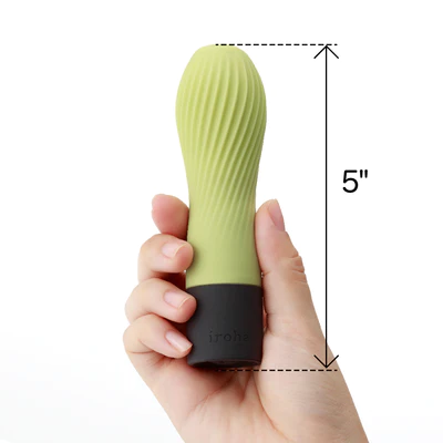 A hand holds a green and black vibrator with a textured surface, measuring 5 inches.