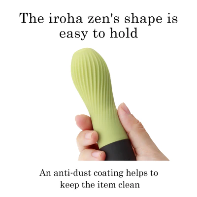 A hand holds a ribbed, light green vibrator with a black base.
