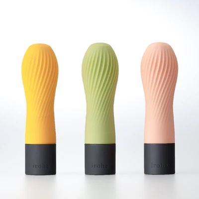 Three vibrators in yellow, green, and pink with ribbed texture and black bases.
