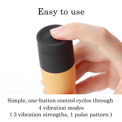 A hand presses the button on a yellow and black vibrator with "iroha" written on it.
