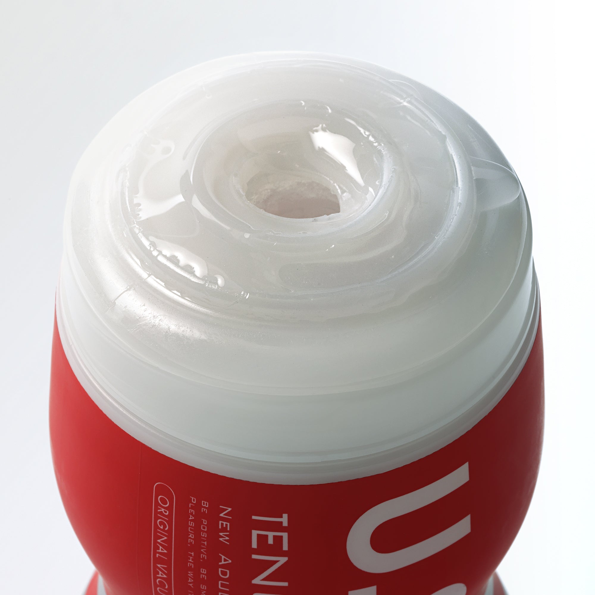 Tenga Ultra Size Original Vacuum Cup male masturbator with red and white casing.