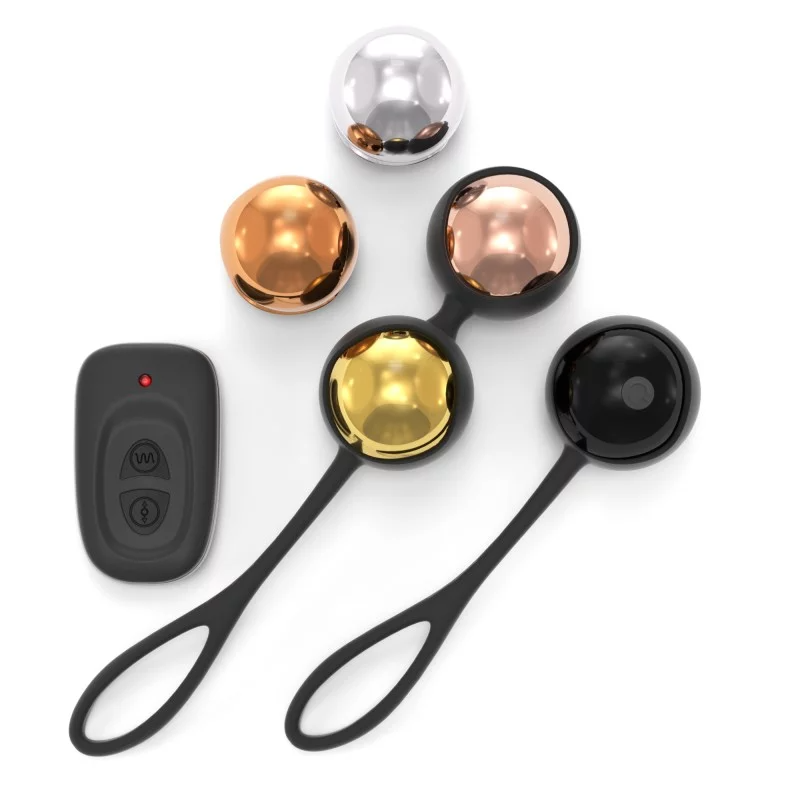 Pelvic training balls in gold, black, copper, and silver with a remote.