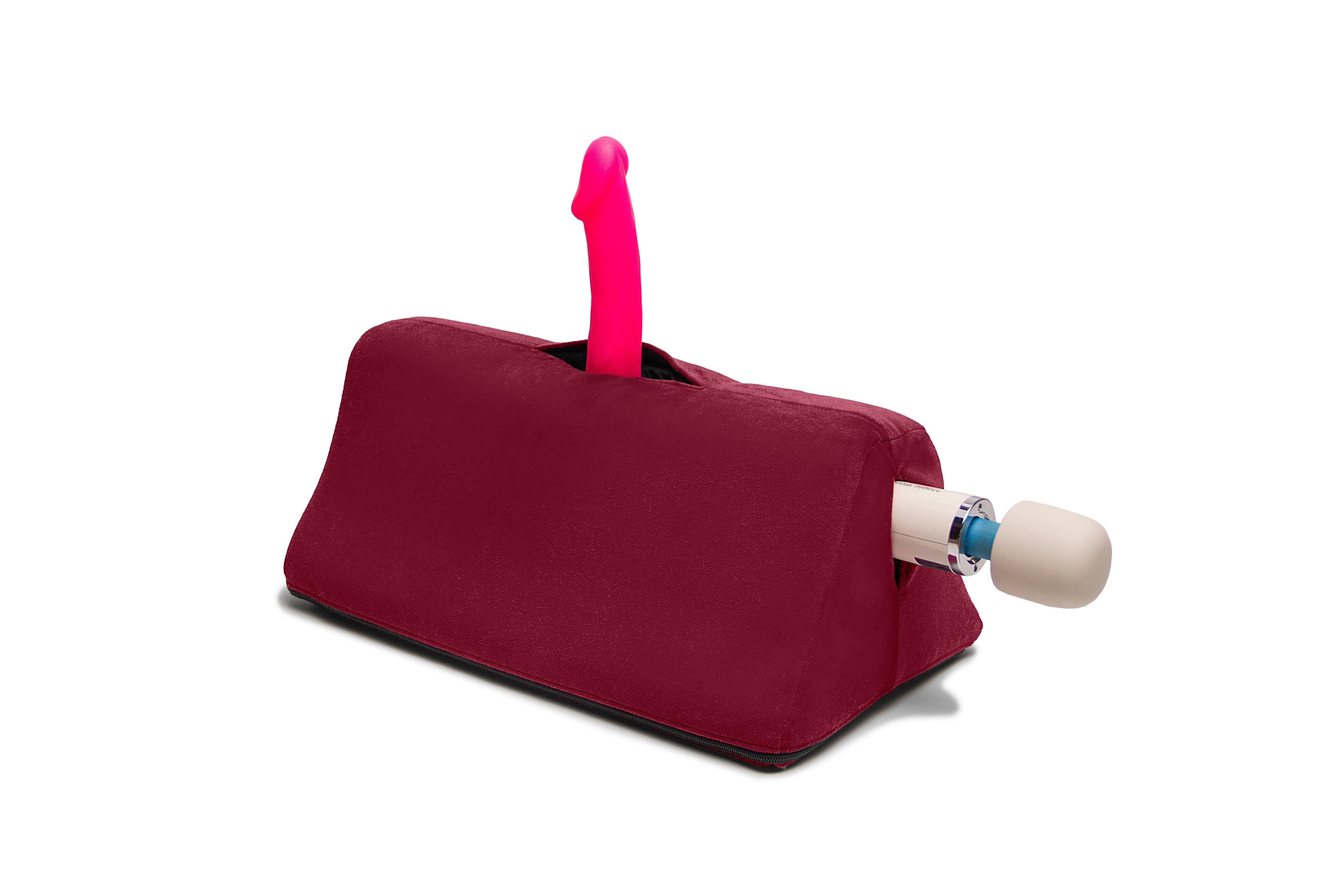 Merlot Tula Toy Mount sex cushion with a pink dildo and a wand.