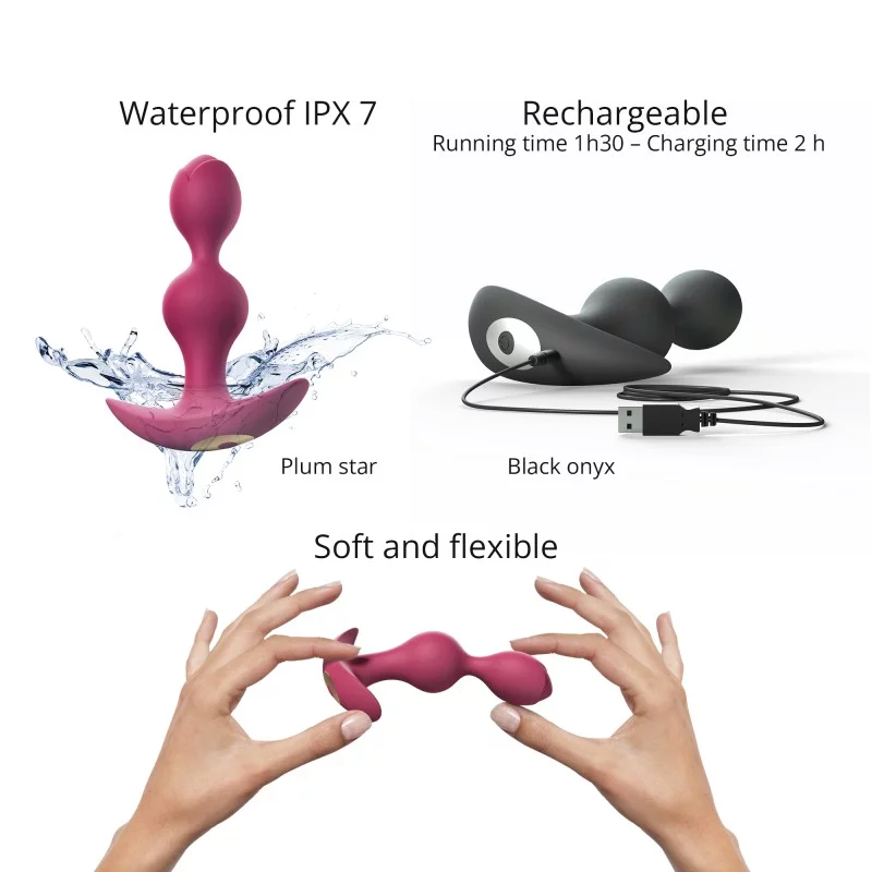 A pink vibrating anal plug with a curved base, shown with water splashes.