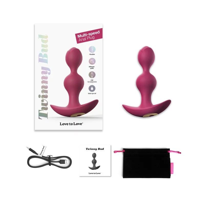A pink silicone anal plug with a flared base, shown with its packaging and accessories.
