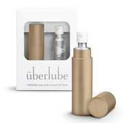 Gold metal refillable Uberlube case with a small insert.