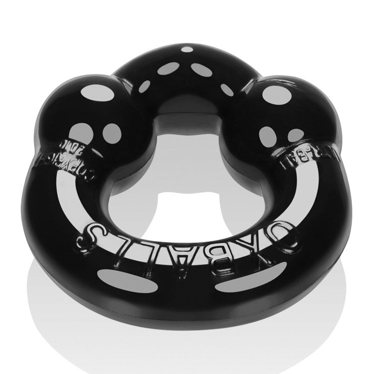 Black stretchy cock ring with white dots and text.