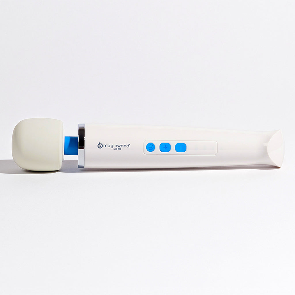 A white Magic Wand Mini massager with a cream-colored head and blue buttons.