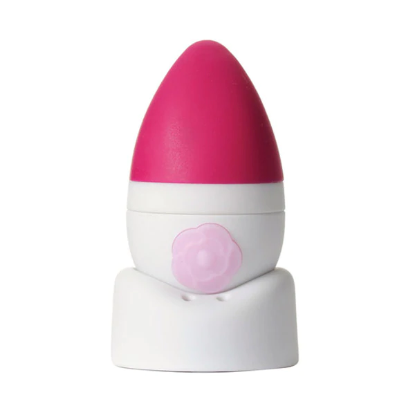 A pink and white vibrator with a flower design on a white base.