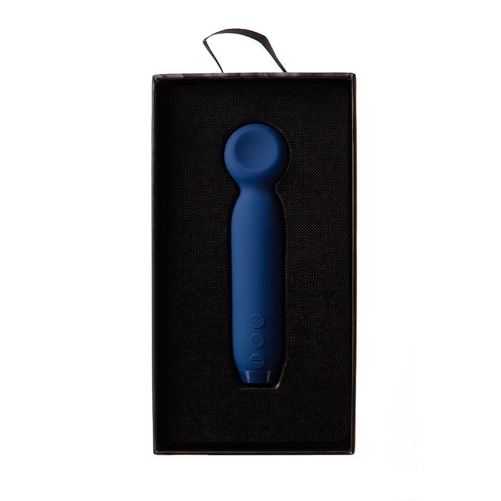 Cobalt blue vibrating bullet in a black box.