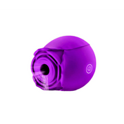 Purple rose-shaped massager with textured interior and a circular emblem.