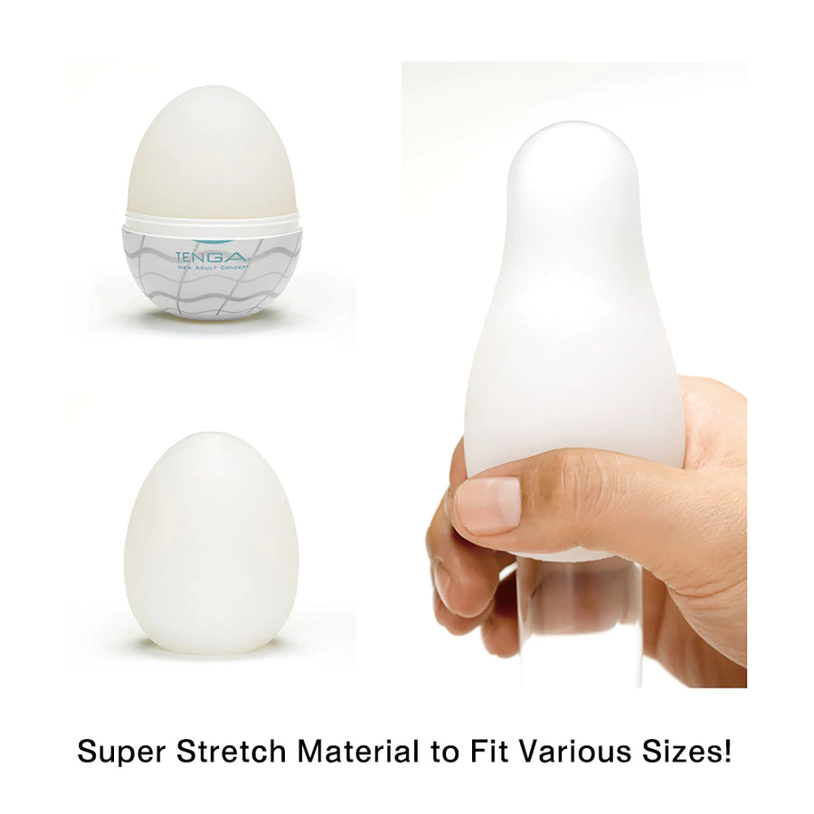 Three white Tenga Egg masturbators, one in packaging, one loose, and one being held.