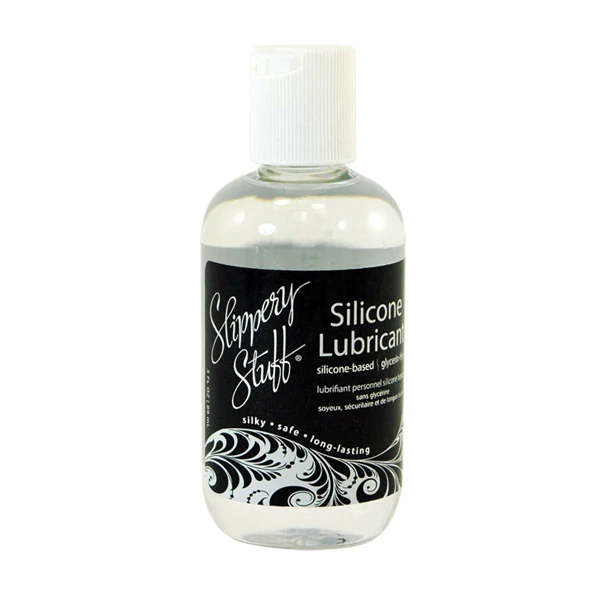 A bottle of Slippery Stuff silicone lubricant with a white cap.