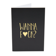 Black card with gold text that says "WANNA FCK?"