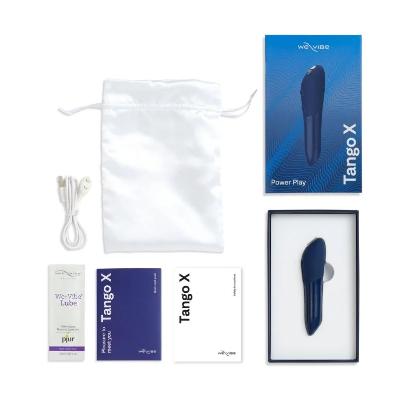 Midnight blue Tango X vibrator with charging cable, storage bag, and instructions.