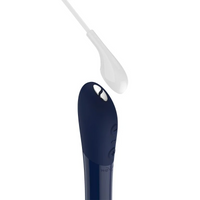 Midnight blue Tango X ball vibrator with a white attachment.