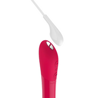 A cherry red vibrator with a white attachment and silver buttons.