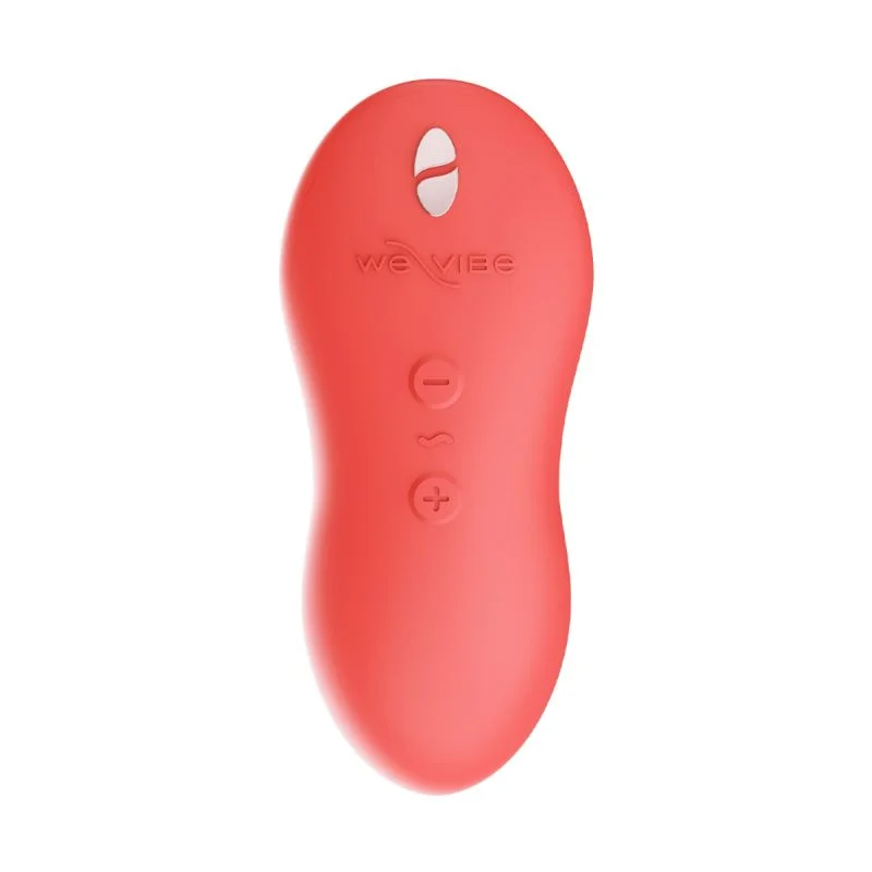 A coral-colored We-Vibe massager with power and vibration control buttons.