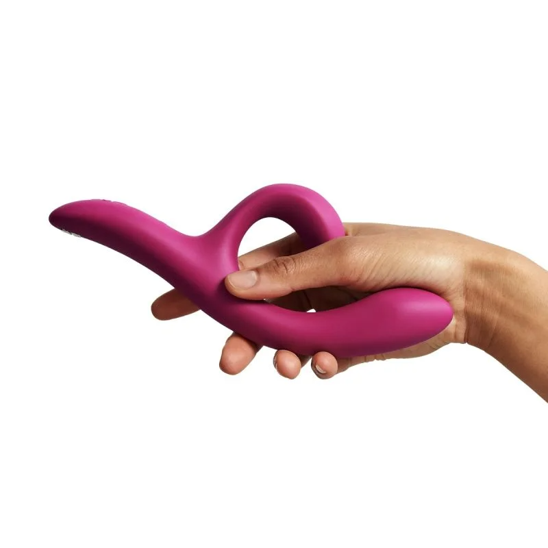 Fuchsia Nova 2 Rabbit Vibrator held in a hand.