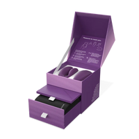 Purple We-Vibe Chorus couples vibrator in an open box with a drawer.