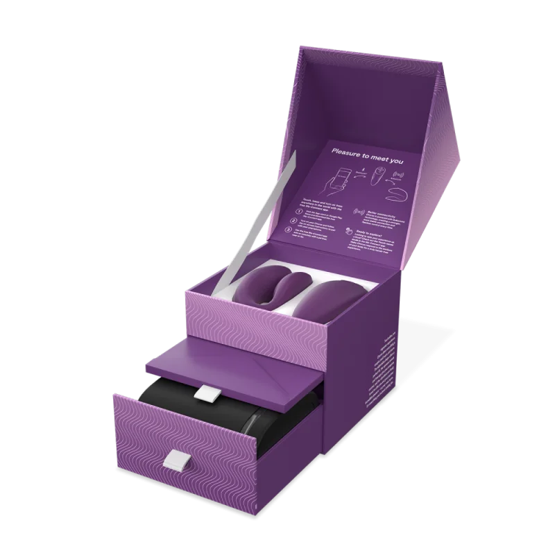 Purple We-Vibe Chorus couples vibrator in an open box with a drawer.