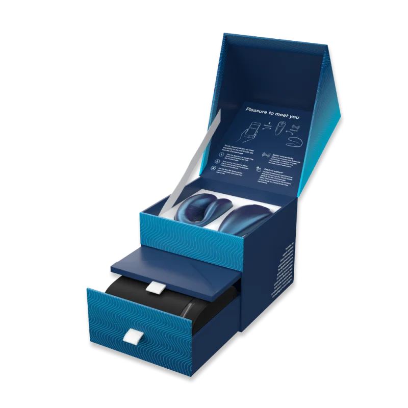 Chorus App-Controlled Couples Vibrator in Cosmic Blue, open box with vibrators and drawer.