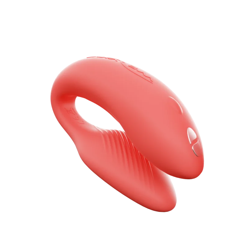 Coral app-controlled couples vibrator with textured inner surface.