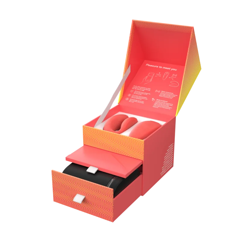 Chorus couples vibrator in a coral box with a drawer.