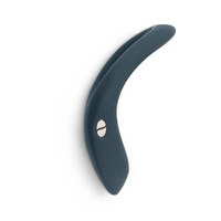 A dark blue vibrating ring with two silver buttons.