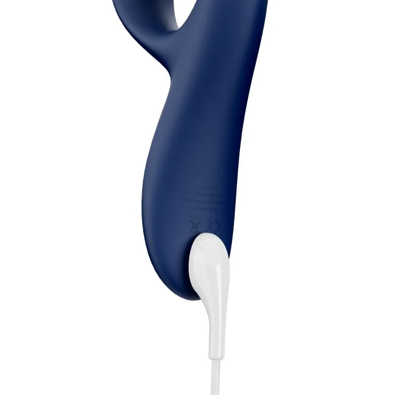 Close-up of a navy blue rabbit vibrator with a white charging cable.