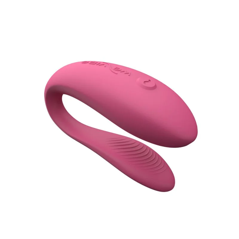 Pink app-controlled couples vibrator with a curved design.