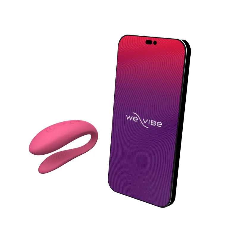 Pink app-controlled couples vibrator next to a smartphone.