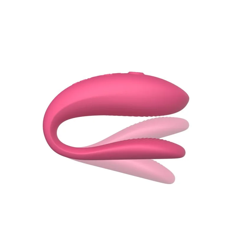 Pink app-controlled couples vibrator with a curved, flexible design.