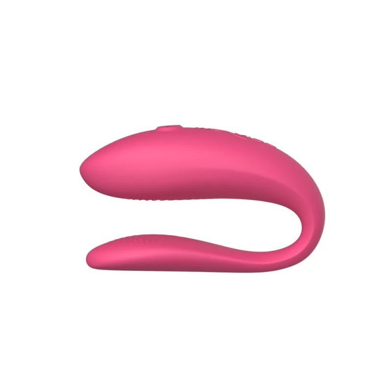 Pink app-controlled couples vibrator with a U-shape.