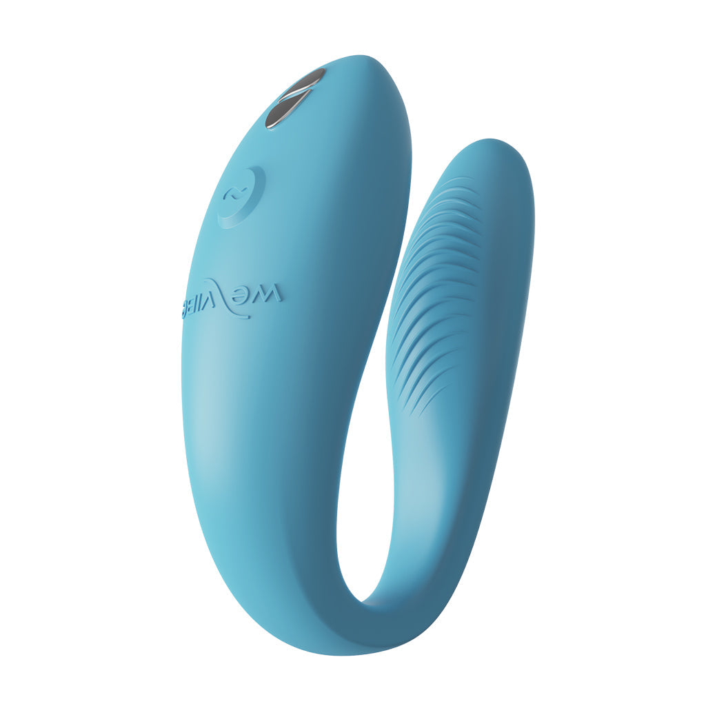 Turquoise C-shaped couples vibrator with textured ridges.