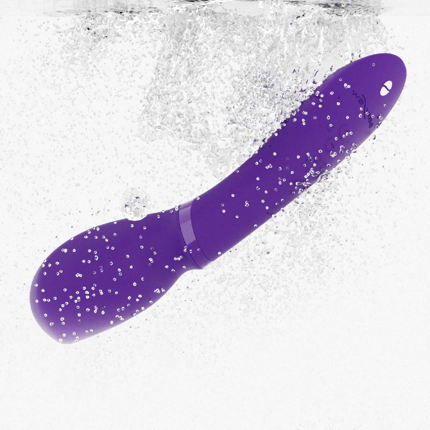 A purple We-Vibe Wand 2 vibrator submerged in water with bubbles.